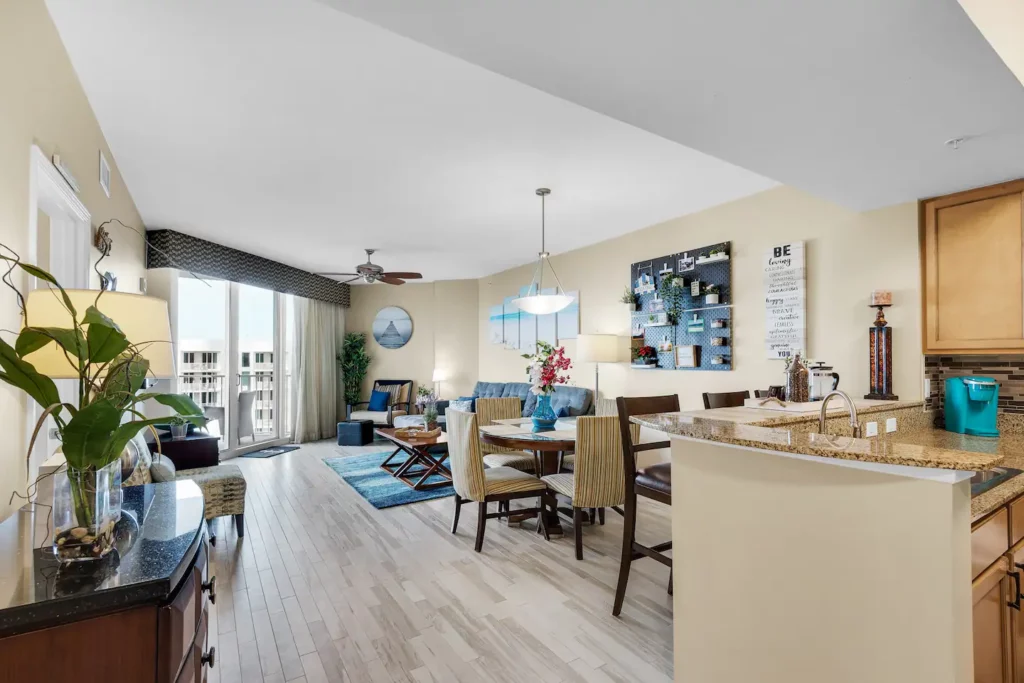 View of the living/dining area directly entering the condo-roomy & plenty of natural light