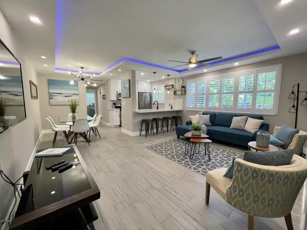 Expansive Living Room surrounded by new soffit, recessed LED lighting.
